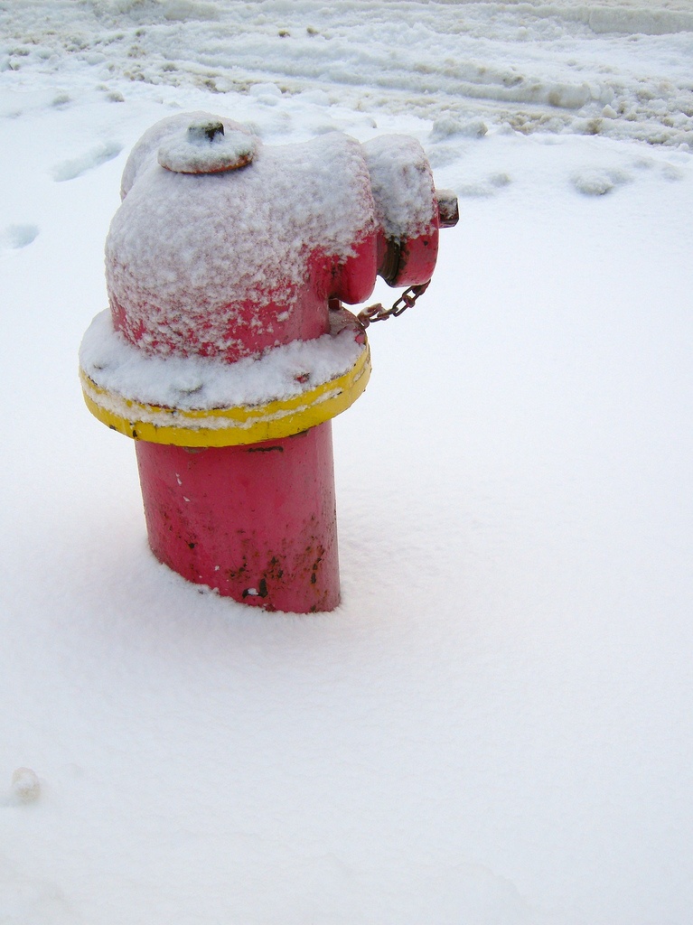 Red Fire Hydrant Covered In Snow